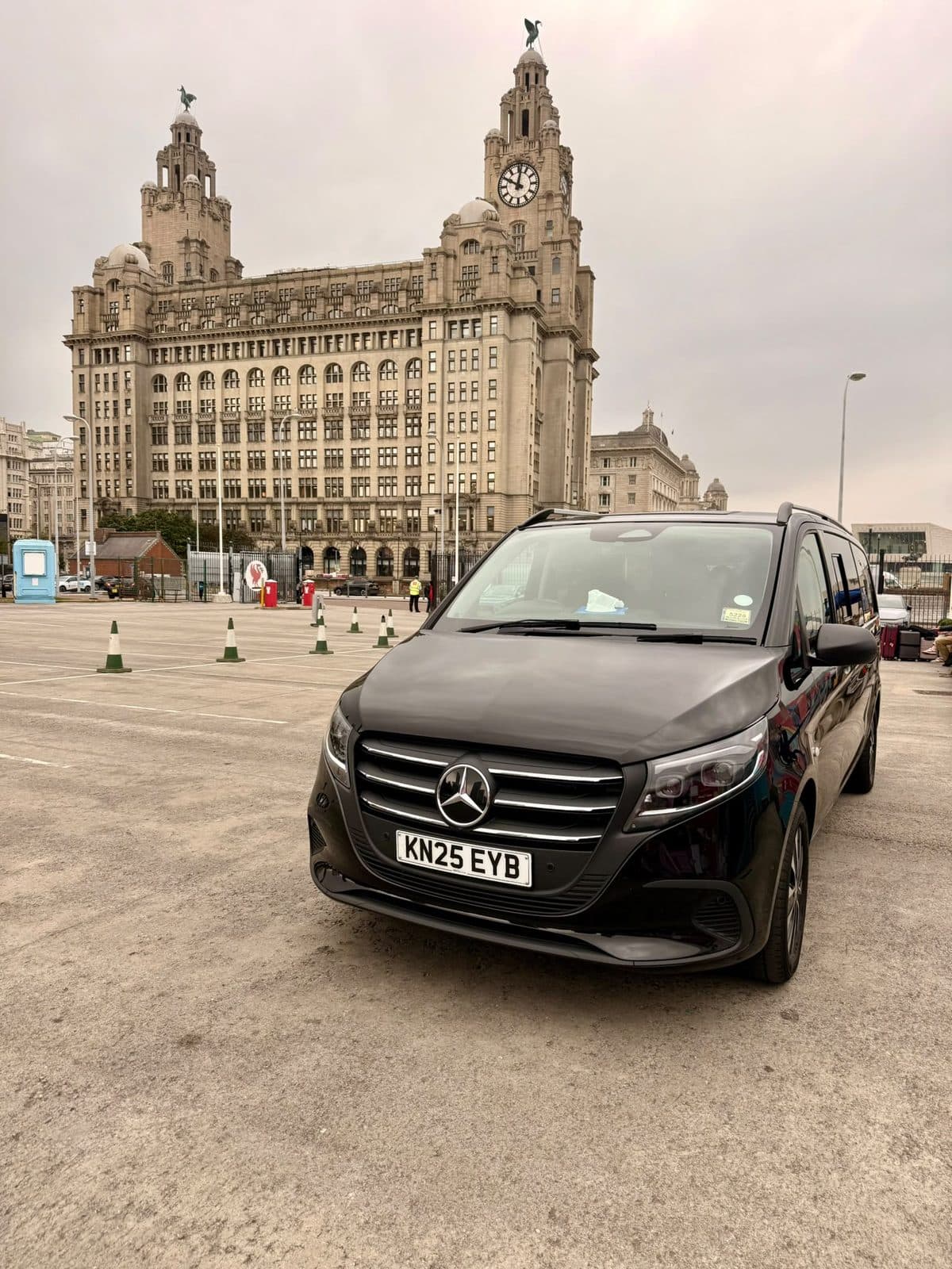 City Wheels Mercedes V-Class parked at Liverpool's Liver Building with passenger luggage